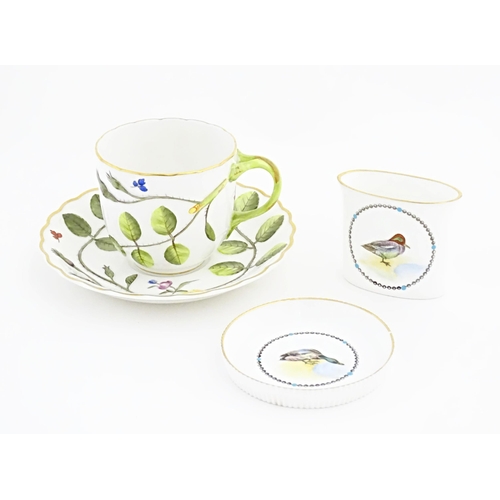 106 - A Royal Worcester tea cup and saucer in The Blind Earl pattern. Together with a Royal Worcester coas... 