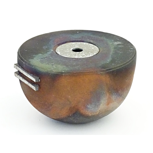 89 - A studio pottery raku pot with flat top by Andrew Niblett. Incised maker's mark under. Approx. 2 1/2... 