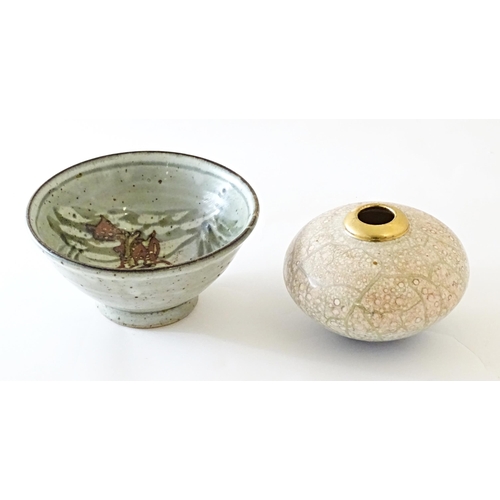 93 - A studio pottery bowl decorated with a duck amongst reeds, with impressed maker's mark to foot. Toge... 