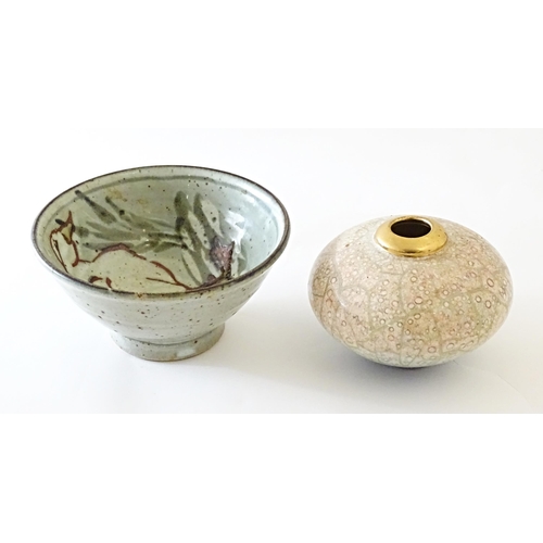 93 - A studio pottery bowl decorated with a duck amongst reeds, with impressed maker's mark to foot. Toge... 