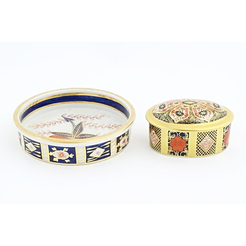 115 - Two items of Royal Crown Derby in the Old Imari pattern comprising pot and cover, and a small plate.... 