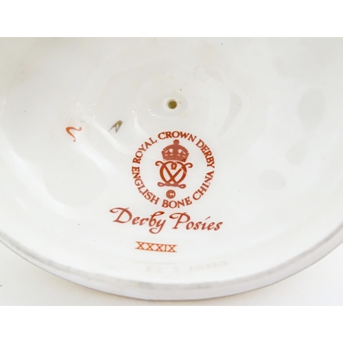 118 - A quantity of Royal Crown Derby tea wares in the Derby Posies pattern to include milk jug, twin hand... 