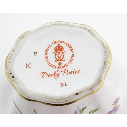 118 - A quantity of Royal Crown Derby tea wares in the Derby Posies pattern to include milk jug, twin hand... 