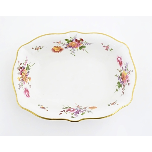 118 - A quantity of Royal Crown Derby tea wares in the Derby Posies pattern to include milk jug, twin hand... 