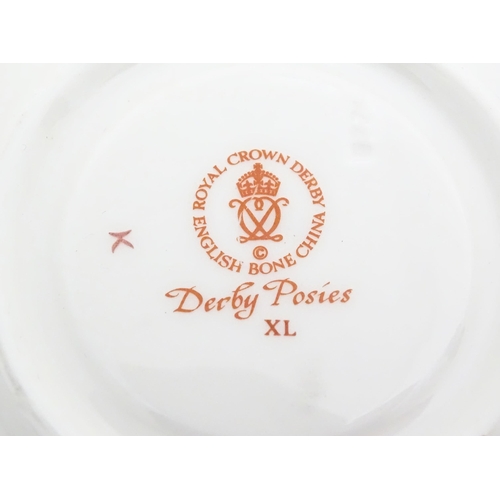 118 - A quantity of Royal Crown Derby tea wares in the Derby Posies pattern to include milk jug, twin hand... 