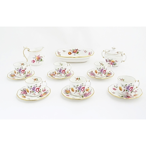 118 - A quantity of Royal Crown Derby tea wares in the Derby Posies pattern to include milk jug, twin hand... 