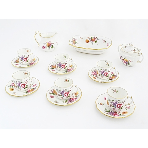 118 - A quantity of Royal Crown Derby tea wares in the Derby Posies pattern to include milk jug, twin hand... 