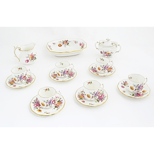 118 - A quantity of Royal Crown Derby tea wares in the Derby Posies pattern to include milk jug, twin hand... 