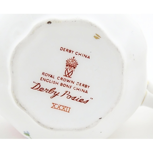 119 - Five items of Royal Crown Derby in the Derby Posies pattern to include jug, tea cup and saucer, etc.... 