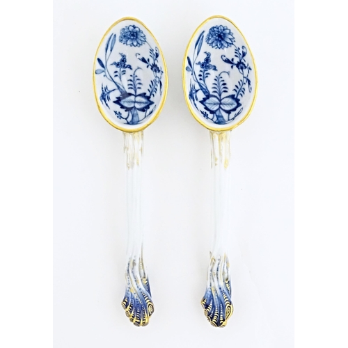 120 - A pair of Continental ceramic blue and white salad servers / spoons, decorated with floral and folia... 