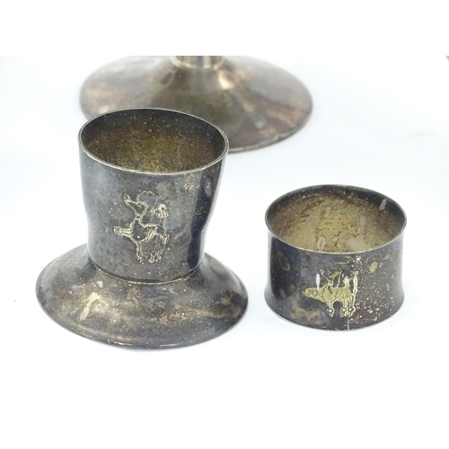 524 - A quantity of assorted silver plated and other metal wares to include candlestick, card tray, cups, ... 