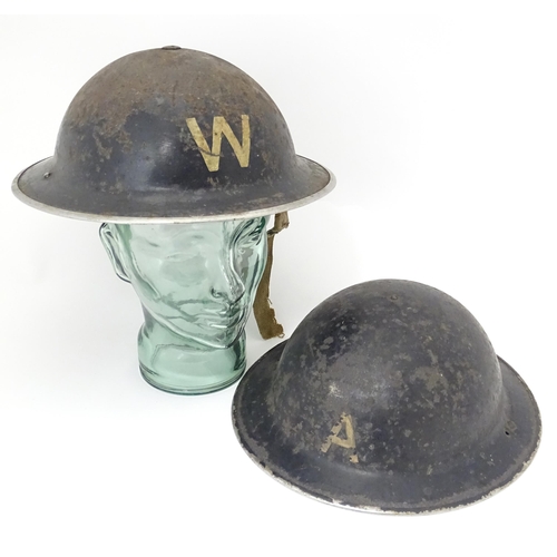 802 - Militaria : two WWII / World War 2 / WW2 / Second World War Civil Defence 'Brodie' helmets, marked '... 