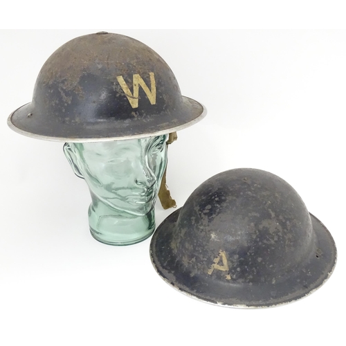 802 - Militaria : two WWII / World War 2 / WW2 / Second World War Civil Defence 'Brodie' helmets, marked '... 