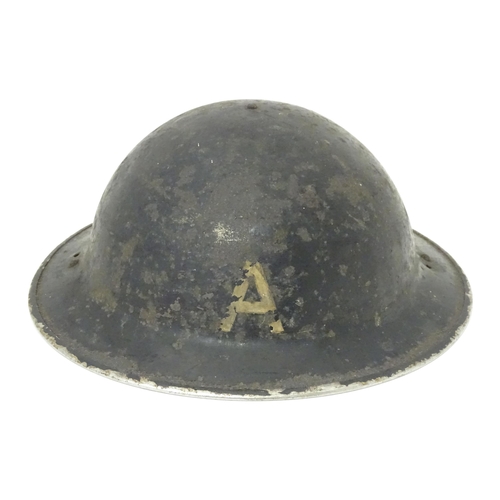 802 - Militaria : two WWII / World War 2 / WW2 / Second World War Civil Defence 'Brodie' helmets, marked '... 