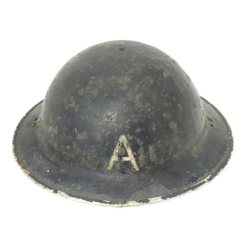 802 - Militaria : two WWII / World War 2 / WW2 / Second World War Civil Defence 'Brodie' helmets, marked '... 