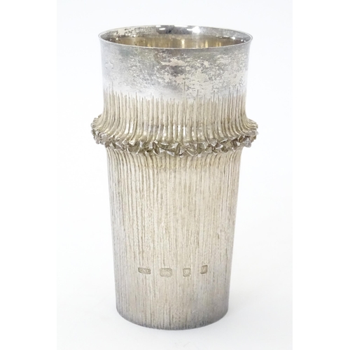 268 - Christopher Nigel Lawrence : An Elizabeth II Modernist set of six silver beakers / cups with texture... 