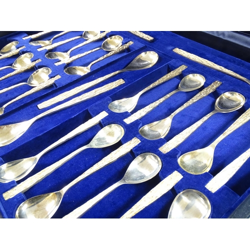 274 - Christopher Nigel Lawrence : An Elizabeth II Modernist silver 12 place canteen of cutlery / flatware... 