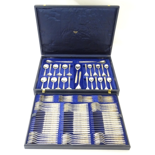 274 - Christopher Nigel Lawrence : An Elizabeth II Modernist silver 12 place canteen of cutlery / flatware... 