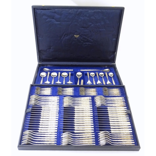 274 - Christopher Nigel Lawrence : An Elizabeth II Modernist silver 12 place canteen of cutlery / flatware... 