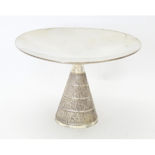 272 - Christopher Nigel Lawrence : An Elizabeth II Modernist silver tazza / comport with  textured conical... 