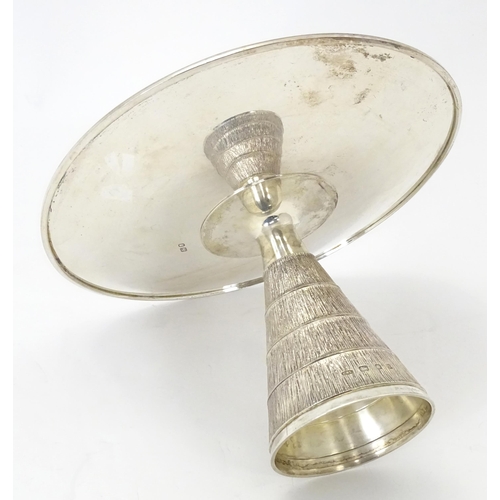 272 - Christopher Nigel Lawrence : An Elizabeth II Modernist silver tazza / comport with  textured conical... 