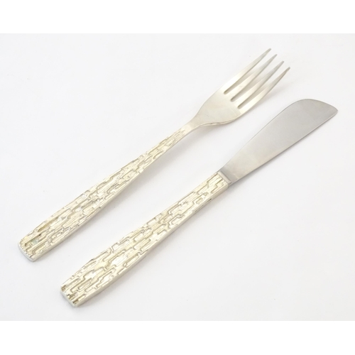 274 - Christopher Nigel Lawrence : An Elizabeth II Modernist silver 12 place canteen of cutlery / flatware... 