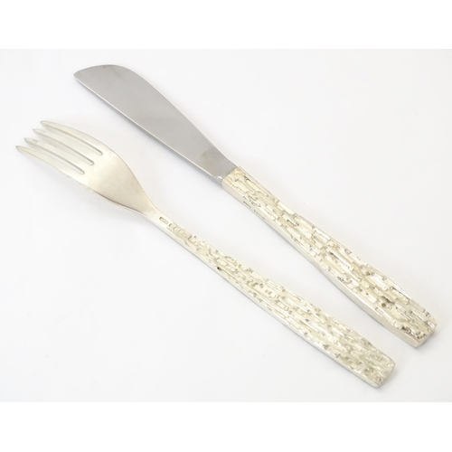 274 - Christopher Nigel Lawrence : An Elizabeth II Modernist silver 12 place canteen of cutlery / flatware... 