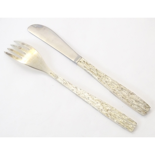 274 - Christopher Nigel Lawrence : An Elizabeth II Modernist silver 12 place canteen of cutlery / flatware... 