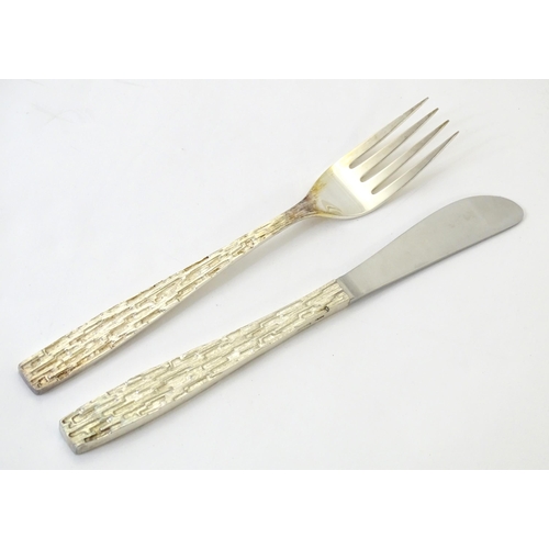 274 - Christopher Nigel Lawrence : An Elizabeth II Modernist silver 12 place canteen of cutlery / flatware... 