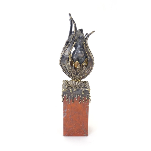 George Weil : A silver, silver gilt and 18ct gold sculpture formed as a female torso emerging from a flower bud with textured detail and mounted on a rectangular marble plinth base. Hallmarked London 1972, maker George Weil, signed to plaque G. Weil 18ct no 81 1972. Approx. 9 1/2" high
George Breuer-Weil was born in Vienna in 1938 into a family of jewellers, he studied in London at St. Martin's School of Art, and went on to specialist in sculpture, painting and jewellery.