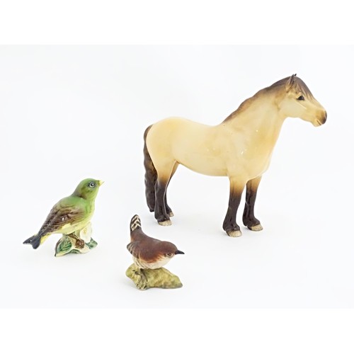 129A - Three Beswick model animals to include a Highland pony / horse, and two birds, a wren and a greenfin... 