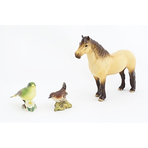 129A - Three Beswick model animals to include a Highland pony / horse, and two birds, a wren and a greenfin... 