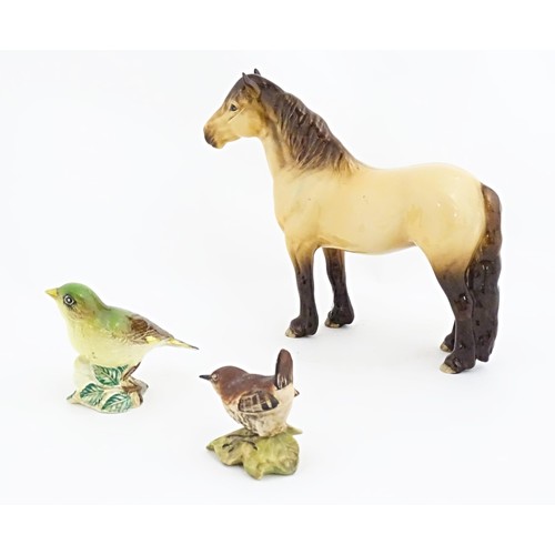 129A - Three Beswick model animals to include a Highland pony / horse, and two birds, a wren and a greenfin... 