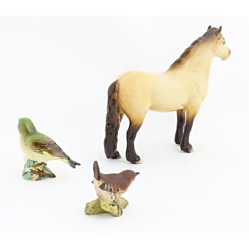 129A - Three Beswick model animals to include a Highland pony / horse, and two birds, a wren and a greenfin... 