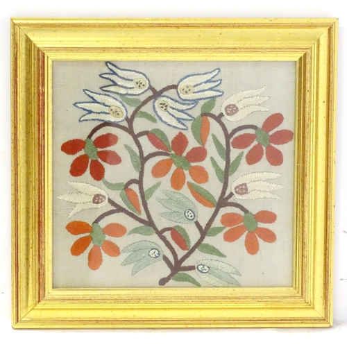 A Victorian needlework embroidery depicting a floral sprig with Islamic
