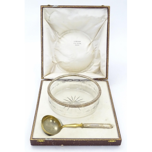 528 - A cut and etched glass bowl with French silver gilt rim together with a serving spoon / ladle with F... 