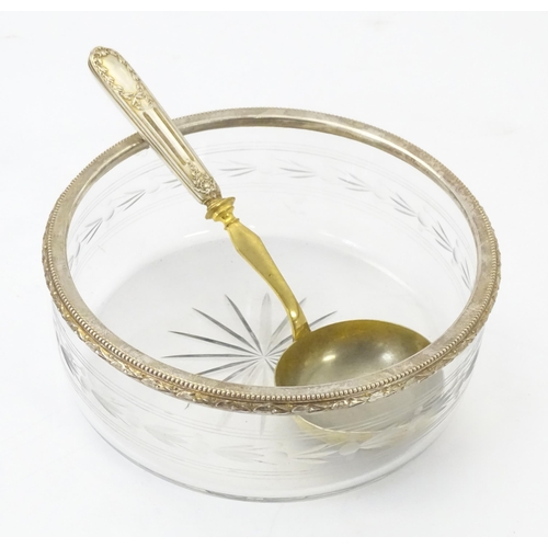 528 - A cut and etched glass bowl with French silver gilt rim together with a serving spoon / ladle with F... 