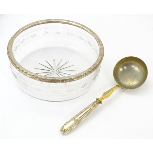 528 - A cut and etched glass bowl with French silver gilt rim together with a serving spoon / ladle with F... 