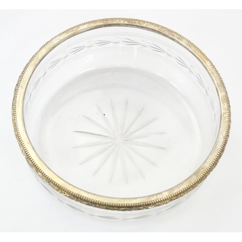 528 - A cut and etched glass bowl with French silver gilt rim together with a serving spoon / ladle with F... 