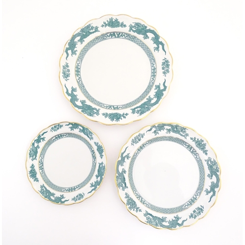 150 - A quantity of dinner wares in the Dragon pattern, to include dinner plates, side plates, milk jugs, ... 