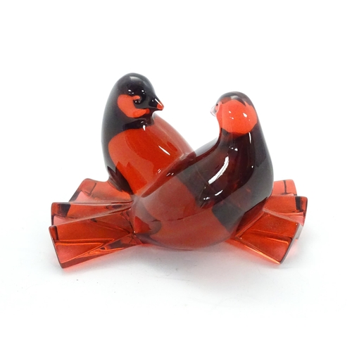 158 - Baccarat Crystal : A red glass model of two love birds / doves. Marked under. Approx 2 1/2