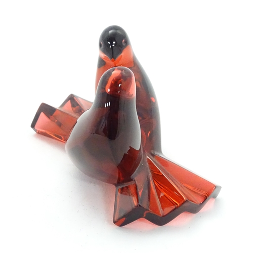 158 - Baccarat Crystal : A red glass model of two love birds / doves. Marked under. Approx 2 1/2