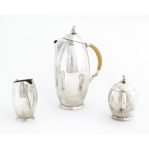 963 - A 20thC three piece silver plate coffee set by Rogers Bros. in the pattern Flair, comprising coffee ... 