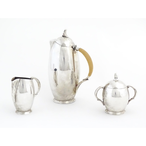 963 - A 20thC three piece silver plate coffee set by Rogers Bros. in the pattern Flair, comprising coffee ... 