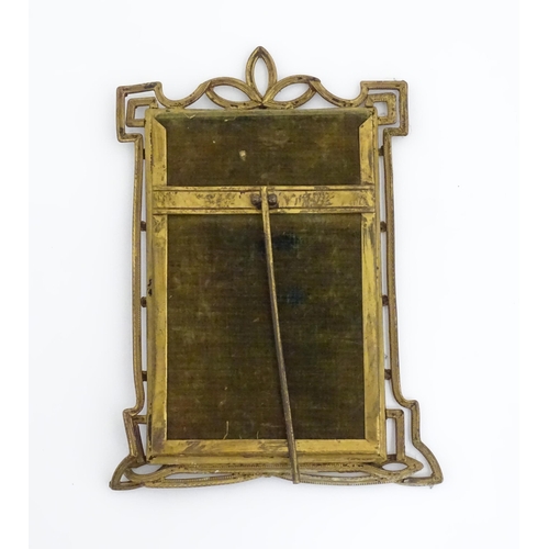 969 - A Victorian brass easel back photo frame with floral detail. Approx. 8 3/4