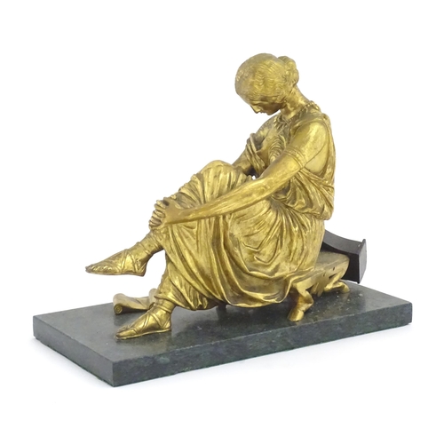 977 - A French cast gilt sculpture depicting the poet Sappho seated with a lyre, after Jean-Jacques (1792-... 