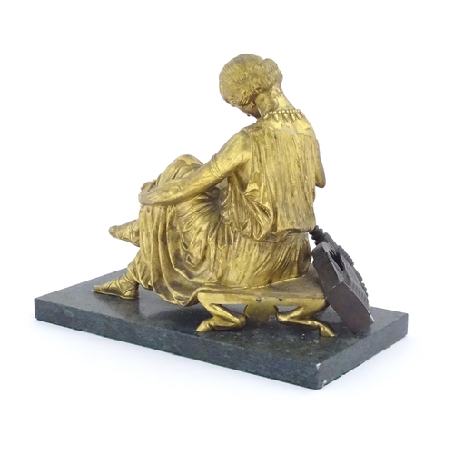 977 - A French cast gilt sculpture depicting the poet Sappho seated with a lyre, after Jean-Jacques (1792-... 