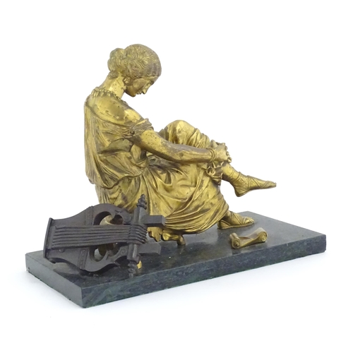 977 - A French cast gilt sculpture depicting the poet Sappho seated with a lyre, after Jean-Jacques (1792-... 