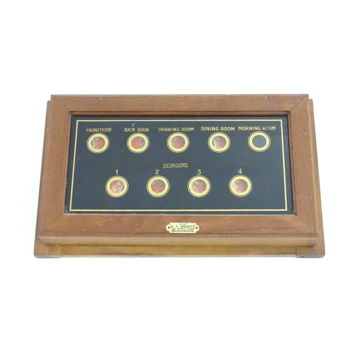 979 - An early 20thC butlers / servants bell board with verre eglomise glass display with nine indicators.... 