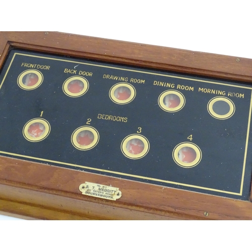 979 - An early 20thC butlers / servants bell board with verre eglomise glass display with nine indicators.... 